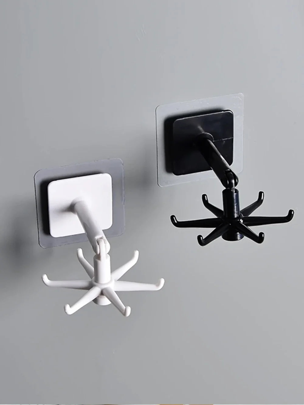 Rotatable wall mounted spoon and spatula hanger, black, mounted on kitchen wall