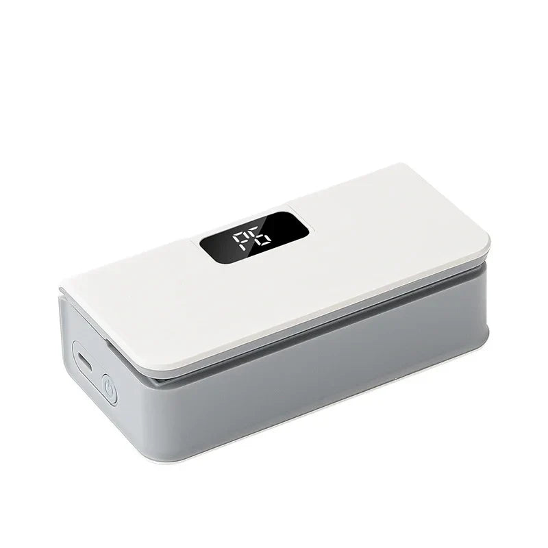 Rechargeable mini bag sealer sealing a bag of chips