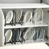 Stackable plate rack organizing pans and cutting boards in a cabinet