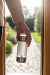 Personal blender held in one hand showing compact portable size