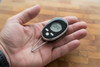 Meat thermometer held in one hand showing compact size