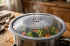 Spill-stopper lid doubling as a steamer lid over vegetables