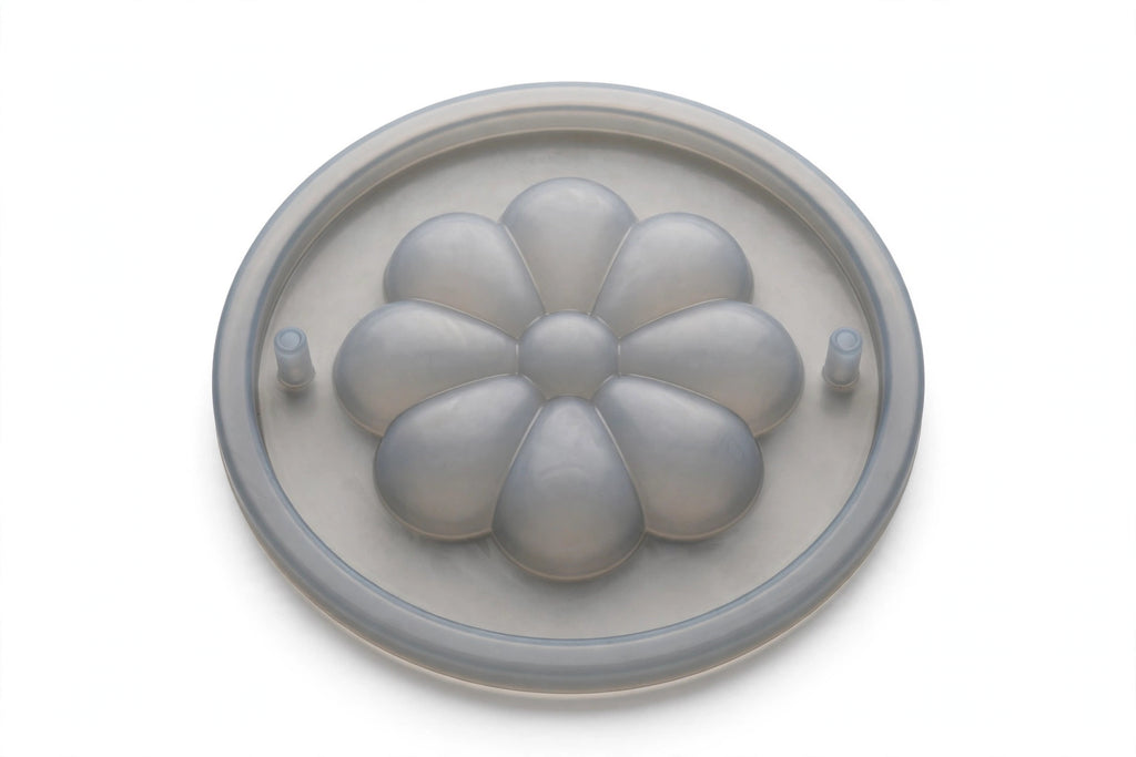 Silicone Spill-Stopper Lid – flower-petal boil-over preventer on white background