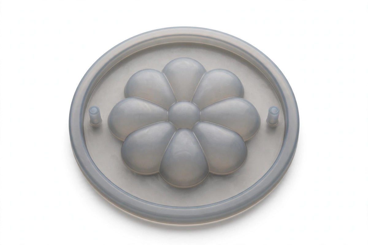 Silicone Spill-Stopper Lid – flower-petal boil-over preventer on white background