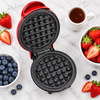 Top-down flat lay of waffle maker with berries